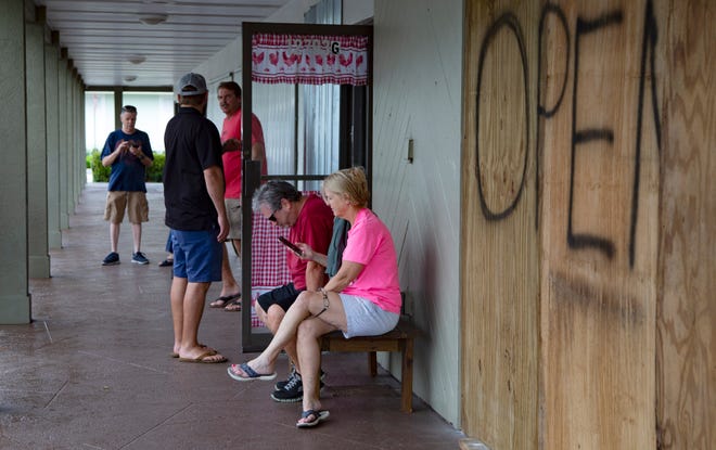 Patrons wait for a breakfast table at Gabriel's Cafe & Grill in Wellington as the restaurant was one of the few open Tuesday morning while Hurricane Dorian feeder bands passed over Wellington. [ALLEN EYESTONE/palmbeachpost.com]