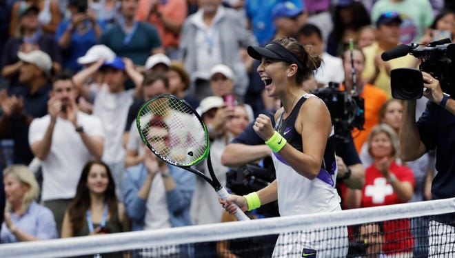 Belinda Bencic reacts after defeating Naomi Osaka 7-5, 6-4 during the fourth round of the US Open on Monday in New York. [Frank Franklin II/The Associated Press]