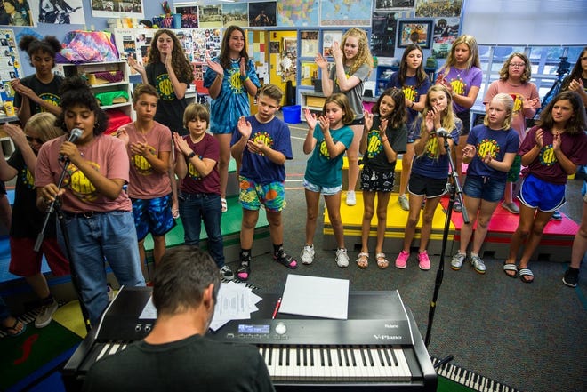The Barton Hills Choir, a group of elementary school students who have performed at ACL Fest every weekend for the past decade, rehearses Aug. 19 at Barton Hills Elementary School. [ELI IMADALI/AMERICAN-STATESMAN]