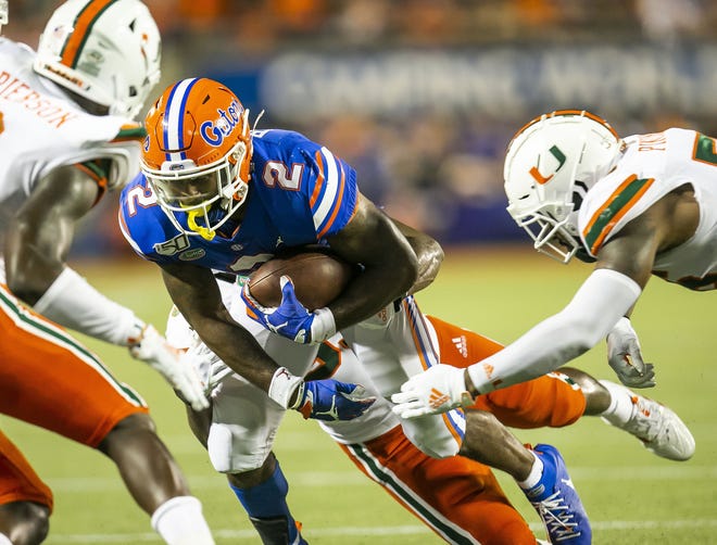 Florida running back Lamical Perine runs up the middle in the second half against Miami on Aug. 24 in Orlando. [Doug Engle/GateHouse Florida]
