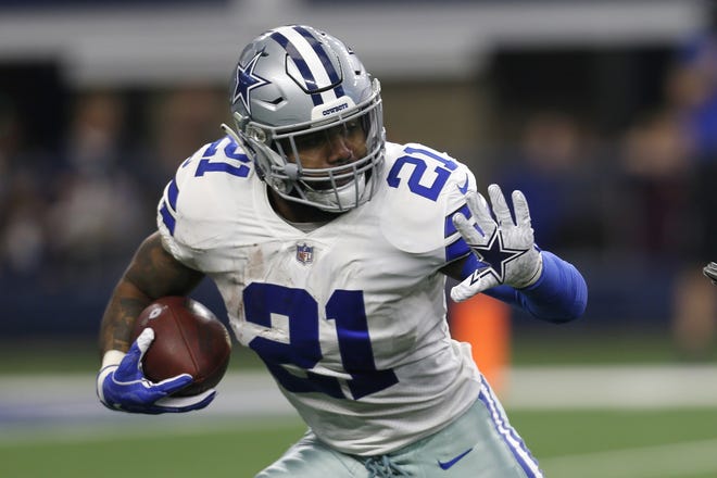 FILE - In this Dec. 23, 2018, file photo, Dallas Cowboys running back Ezekiel Elliott (21) runs the ball against the Tampa Bay Buccaneers during an NFL football game in Arlington, Texas. The Dallas Cowboys and Ezekiel Elliott have agreed on a $90 million, six-year contract extension that will make him the NFL's highest-paid running back and end a holdout that lasted the entire preseason, a person with knowledge of the agreement said Wednesday, Sept. 4, 2019. (AP Photo/Roger Steinman, File)