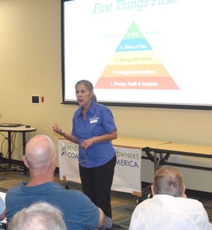 Co-founder of Pueblo-based Renewable Energy Owners Coalition of America, Roz de Lizarriturri, speaks to interested solar consumers at a REOCA workshop at the Pueblo West Library in August. [View photo/Anthony Sandstrom]