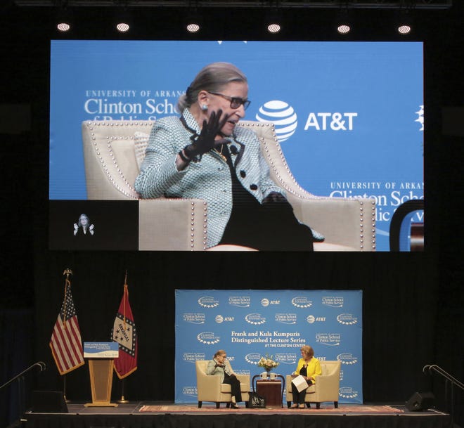 Supreme Court Justice Ruth Bader Ginsburg, bottom left, and top, on video screen, speaks Tuesday before a large crowd at Verizon Arena in North Little Rock. She was interviewed by National Public Radio's Nina Totenberg, right. [John Sykes Jr./The Arkansas Democrat-Gazette via AP]