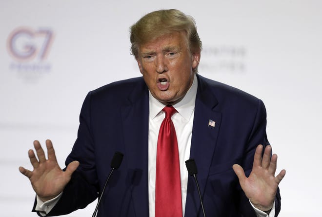 In this Aug. 26, 2019, photo, President Donald Trump gestures during a news conference on the third and final day of the G-7 summit in Biarritz, France. (AP Photo/Markus Schreiber)