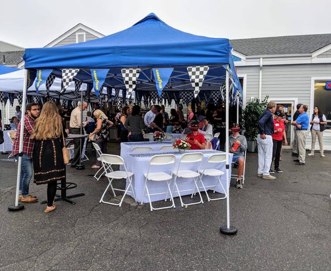Chamber members attending the Aug. 21 Business After Hours celebrate Cape Tire Service's 55th year of doing business in Hyannis. [PHOTOS COURTESY OF AIMEE GUTHINGER]