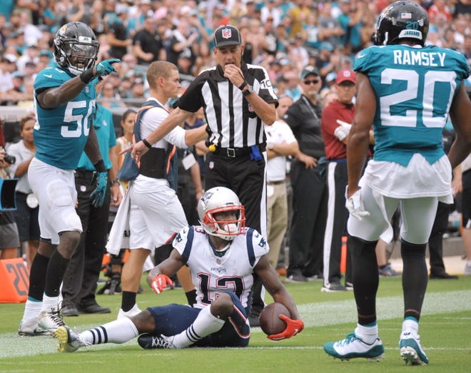 Jaguars linebacker Telvin Smith (left) and cornerback Jalen Ramsey talk after tackling New England Patriots wide receiver Phillip Dorsett for no gain last season. Ramsey and the Jaguars face high-powered Kansas City in the season opener on Sunday. [Bob Self/Florida Times-Union]