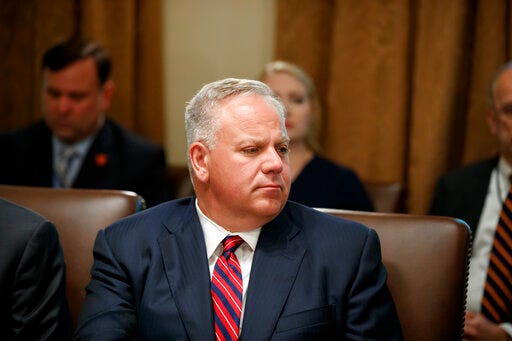 FILE - In this July 16, 2019 file photo interior Secretary David Bernhardt listens during a Cabinet meeting in the Cabinet Room of the White House in Washington. On Thursday, Sept. 5, 2019, 30 retired executives from the Bureau of Land Management, which Bernhardt oversees, wrote him a letter saying that moving the bureau headquarters to Grand Junction, Colorado, and dispersing managers across 11 Western states could lead to worse stewardship of public lands. The department announced the move in July, saying it would lead to better decisions and save money, but some retired federal employees dispute that. (AP Photo/Alex Brandon, File)