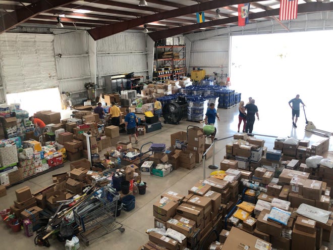The hanger floor at Agape Flights on Thursday, Sept. 5, 2019, was covered with supplies to support relief efforts in the Bahamas. Pilots from the flight service have volunteered time and fuel to deliver personal hygiene products and essential supplies to the area that was ravaged by a Category 5 hurricane Sunday, Sept. 1, 2019. [COURTESY OF AGAPE FLIGHTS]