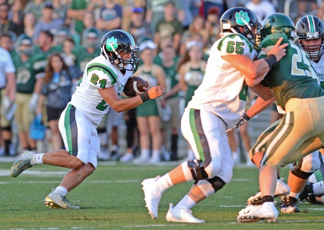 Van Buren's Brayden Rivas, from left, follows the blocking of Jackson Hurst on Alma's Tommy Patton to find the end zone on Tuesday, Aug. 28, 2018, in Alma. [BRIAN D. SANDERFORD/TIMES RECORD]