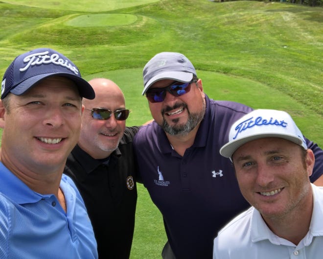 Jason Radzevich and Bill Tringali of Duxbury, former Patriots star Joe Andruzzi, and Gary Sheehan of Cape Medical Supply participate in a golf tournament August 27 at The Ridge Club in Sandwich. Proceeds from the tournament went to support the Sandwich Food Pantry. (Photo courtesy of Laurie Ray)
