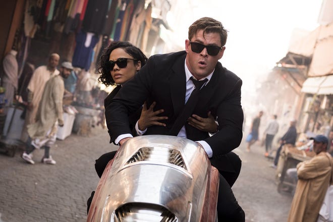 Tessa Thompson, left, and Chris Hemsworth star in "Men in Black: International." [Contributed by Giles Keyte, Columbia Pictures]