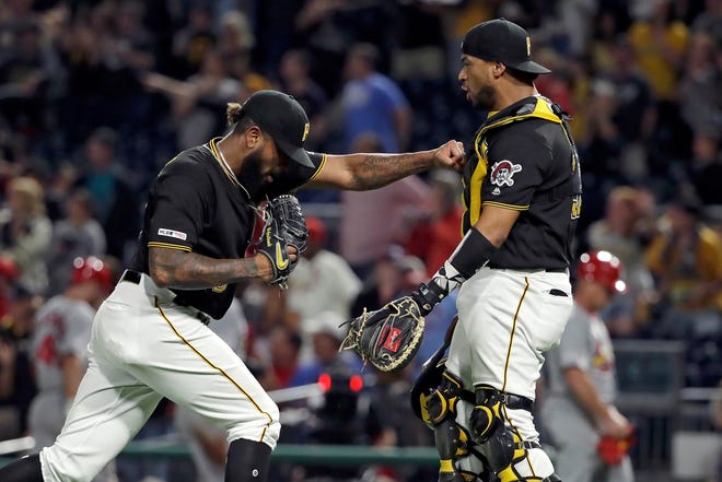 Pittsburgh Pirates relief pitcher Felipe Vazquez, left, celebrates with catcher Elias Diaz after the team's 9-4 win over the St. Louis Cardinals in a baseball game in Pittsburgh, Friday, Sept. 6, 2019. (AP Photo/Gene J. Puskar)