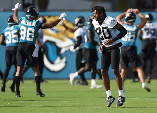 Jalen Ramsey warms up with Jaguars teammates during minicamp drills. [Bob Self/Florida Times-Union]