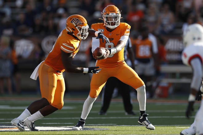 UTEP running back Treyvon Hughes, left, takes a handoff from quarterback Brandon Jones during the first half of a nonconference game against Houston Baptist on Aug. 31 at the Sun Bowl in El Paso, Texas. Jones threw for 268 yards, one touchdown and one interception in the 36-34 win over Houston Baptist. [AP Photo/Andres Leighton]
