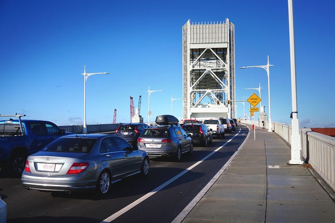 Northbound vehicles await for a ship to pass below during an opening of the Fore River Bridge, Monday, Dec. 3, 2018. Gary Higgins/The Patriot Ledger
