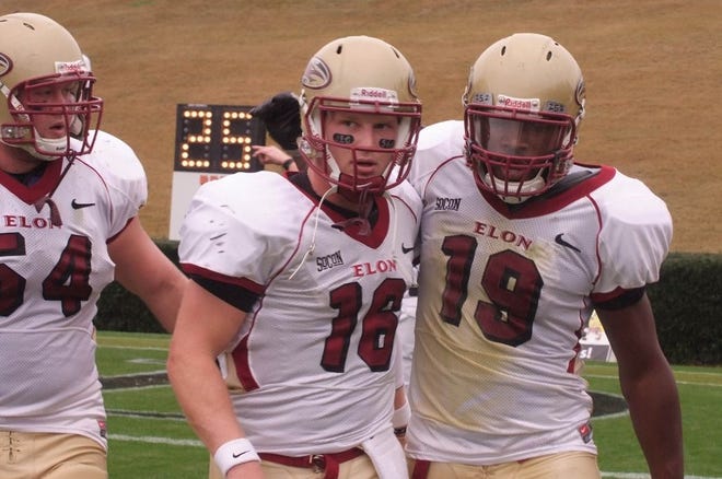 Scott Riddle enjoys an Elon touchdown with go-to receiver Terrell Hudgins, right, in this photo from October 2009, during a blowout of Wofford.