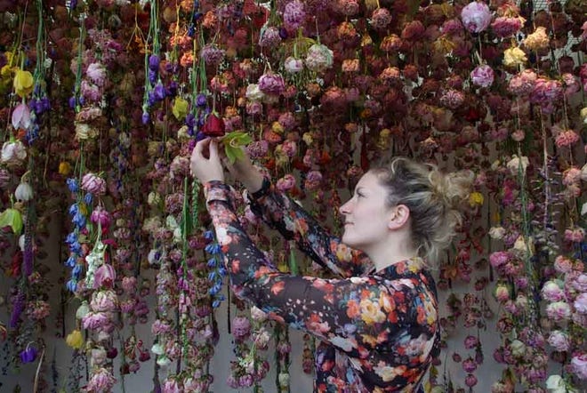Artist Rebecca Louise Law works on an installtion piece. [Contributed]