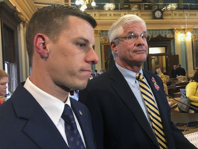FILE - In this May 24, 2019 file photo, Republican House Speaker Lee Chatfield, left, and Republican Senate Majority Leader Mike Shirkey speak with reporters following the Michigan Legislature's approval of auto insurance legislation at the Capitol in Lansing, Mich. Gov. Gretchen Whitmer and state lawmakers who are struggling to find consensus on better funding MichiganþÄôs roads are bracing for an intense final month of deliberations before the deadline to pass a budget. Talks continue between the Democratic governor and Republican legislative leaders. But there is considerable uncertainty over the path forward, including exactly how much more they may agree to spend, how to go about raising it and how the money would be distributed across the state (AP Photo/David Eggert, File)
