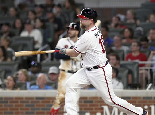 The Braves' Brian McCann hits a two-run home run against the Washington Nationals during the sixth inning Saturday in Atlanta. [TAMI CHAPPELL/THE ASSOCIATED PRESS]