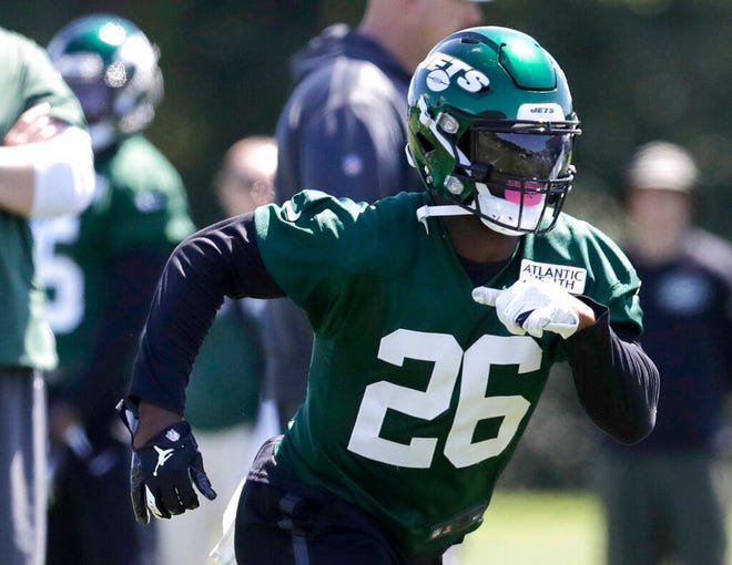 From June 4, 2019, New York Jets running back Le'Veon Bell runs a drill at the team's NFL football training facility in Florham Park, N.J. The New York Jets made lots of major changes in the offseason. The Buffalo Bills did, too. The AFC East rivals are looking for much better results this season _ starting with Sunday's opening game at MetLife Stadium. (AP Photo/Julio Cortez, File)