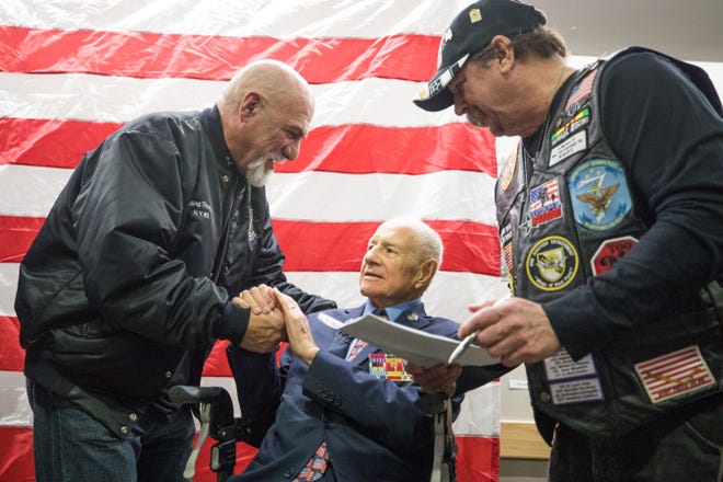Charles Alonge, left, and Paul Rader, right, wish Sen. Bill Larkin good luck at his Dec. 31, 2018, retirement ceremony at the Newburgh Armory Unity Center. [ALLYSE PULLIAM/TIMES HERALD-RECORD FILE PHOTO]