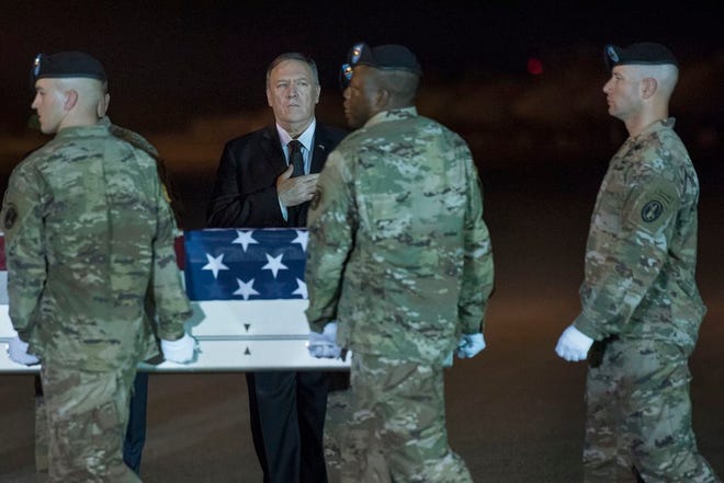 An Army carry team moves a transfer case containing the remains of Sgt. 1st Class Elis Barreto Ortiz, 34, from Morovis, Puerto Rico, past Secretary of State Mike Pompeo, Saturday, Sept. 7, 2019, at Dover Air Force Base, Del. According to the Department of Defense, Ortiz was killed in action Sept. 5, when a vehicle-borne improvised explosive device detonated near his vehicle in Kabul, Afghanistan. Ortiz was supporting Operation Freedom's Sentinel.