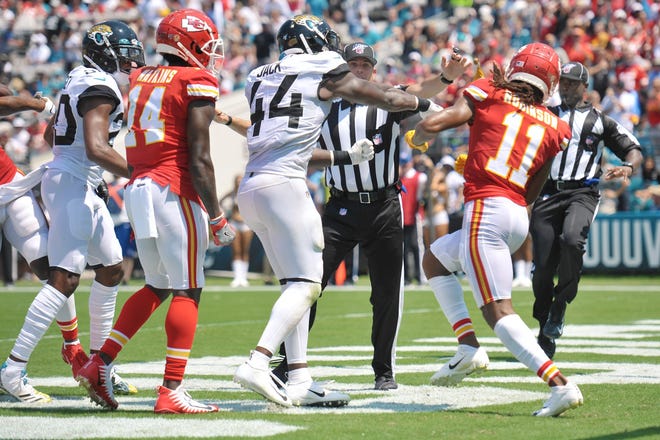Jaguars middle linebacker Myles Jack punches Kansas City Chiefs wide receiver Demarcus Robinson in a scuffle that led to Jack's ejection. [Bob Self/Florida Times-Union]
