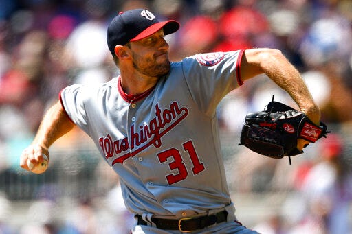 Washington Nationals' Max Scherzer pitches during the first inning of a baseball game against the Atlanta Braves, Sunday, Sept. 8, 2019, in Atlanta. (AP Photo/John Amis)