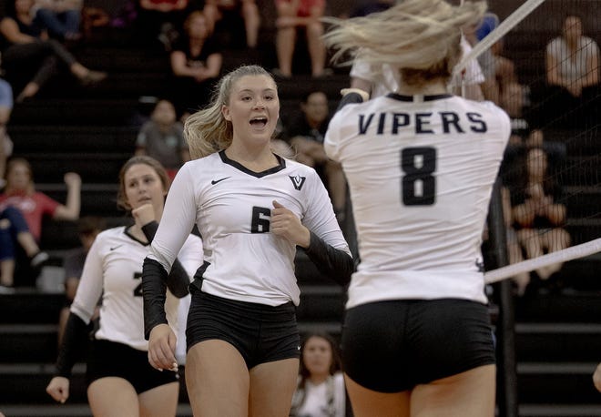 Vandegrift's Annie Stadthaus, center, averaged 12 kills (4.0 per set) while recording five blocks as the Vipers swept Round Rock and Stony Point to earn American-Statesman Player of the Week honors. [NICK WAGNER/AMERICAN-STATESMAN]