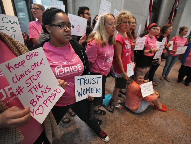Participants in a Planned Parenthood/NARAL Pro Choice rally at the Statehouse. [Chris Russell/Dispatch]