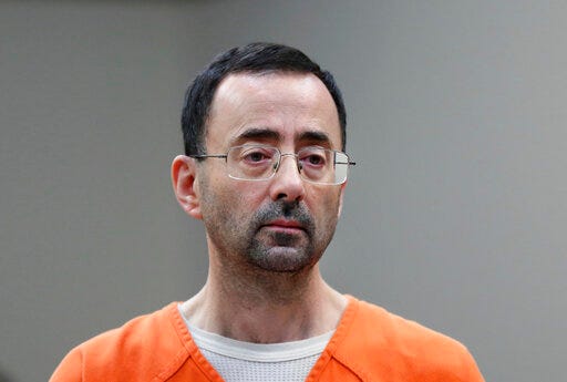 FILE - In this Nov. 22, 2017, file photo, Larry Nassar, 54, appears in court for a plea hearing in Lansing, Mich. The government's $4.5 million fine against Michigan State University in the Nassar sexual assault scandal is unprecedented. The U.S. Education Department has extraordinary leverage over schools that participate in federal student aid programs. (AP Photo/Paul Sancya, File)