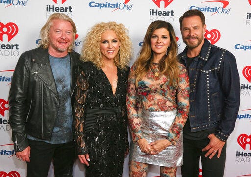 FILE - This May 4, 2019 file photo shows Phillip Sweet, from left, Kimberly Schlapman, Karen Fairchild and Jimi Westbrook, of Little Big Town, at the iHeartCountry Festival in Austin, Texas. The Grammy winners will reveal their self-produced album “Nightfall” at Carnegie Hall on January 16, the night before it is released. (Photo by Jack Plunkett/Invision/AP, File)