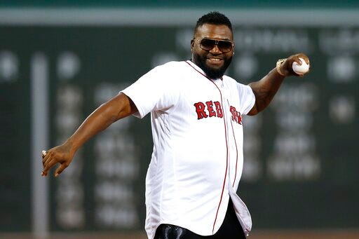 Former Boston Red Sox's David Ortiz throws out a ceremonial first pitch before a baseball game against the New York Yankees in Boston, Monday, Sept. 9, 2019. (AP Photo/Michael Dwyer)