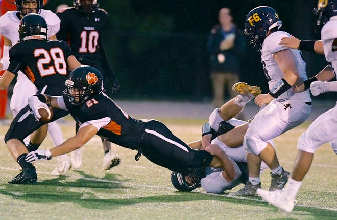 Hackettstown's Jason Kuehner stretches for extra yardage during a game against Jefferson on Friday in Hackettstown. Kuehner tallied an area-best three rushing touchdowns for the Tigers. [Photo by Bob Kiefer/For the New Jersey Herald (NJH)]