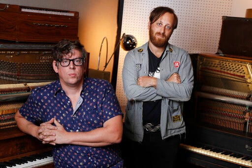In this Aug. 19, 2019, photo, Patrick Carney, left, and Dan Auerbach of The Black Keys pose for a portrait in Nashville, Tenn. The Grammy-winning duo back with their ninth record called “Let’s Rock,” and a new tour starting Sept. 19 in Los Angeles. (AP Photo/Mark Humphrey)