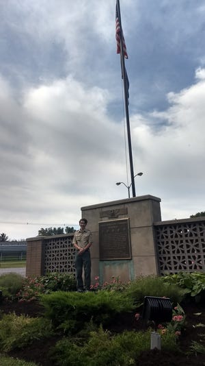 Jacob Tharp stands in front of the veterans monument he renovated in North Sewickley Township for his Eagle Scout project. [Submitted]