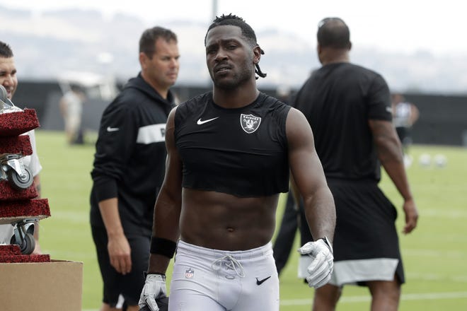 In this Aug. 20, 2019 file photo, Oakland Raiders player Antonio Brown walks off the field after practice in Alameda, Calif. [Photo by AP]