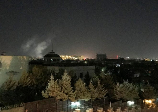 A plume of smoke rises near the U.S. Embassy in Kabul, Afghanistan on Wednesday. A blast was heard shortly after midnight on the anniversary of the 9/11 attacks.