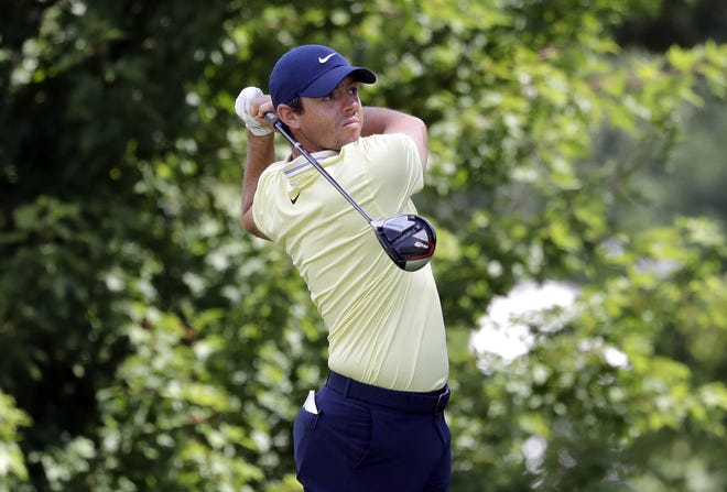 Rory Mcllroy watches his tee shot on the fifth hole during the first round of the BMW Championship golf tournament at Medinah Country Club on Thursday, Aug. 15 in Medinah, Ill. Mcllroy will tee it up again just 17 days after winning the FedEx Cup. [NAM Y. HUH/THE ASSOCIATED PRESS]