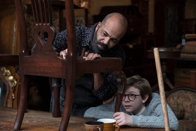 The kindly Hobie (Jeffrey Wright) mentors Theodore (Oakes Fegley) in antiques. [Warner Bros.]