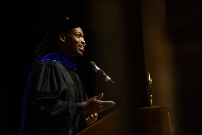 Caylin Louis Moore addresses the crowd Monday at the 2019 Fall Convocation at Fayetteville State University. Moore, a Rhodes Scholar and author, spoke of his 'humble beginnings' and encouraged audience members to see all tasks in life, no matter how menial, as important and worth great effort and care. [Melissa Sue Gerrits/The Fayetteville Observer]