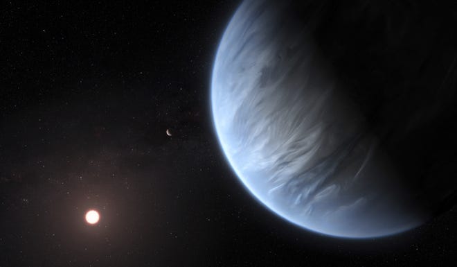 This artist's rendering provided by University College London Centre for Space Exochemistry Data researchers shows Exoplanet K2-18b, foreground, its host star and an accompanying planet in this system. On Wednesday, the scientists announced they discovered water on the planet outside our solar system that has temperatures suitable for life. (M. Kornmesser/ESA/Hubble via AP)