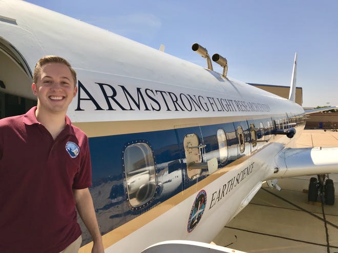 Charley Fite, of Belmont, poses with NASA's DC-8 aircraft, which is the main plane that NASA uses to fly all over the world doing all types of Earth science research in places including Antarctica, Greenland, Africa, Asia, and the United States. The plane is fitted with roughly 30 different instruments that take measurements, specifically for Fite and his team's current mission: measurements of smoke and cloud particles, and more than 100 different chemical compounds that can chemically react in the atmosphere, contribute to air pollution, and impact the climate. [CHARLEY FITE/SPECIAL TO THE GASTON GAZETTE]