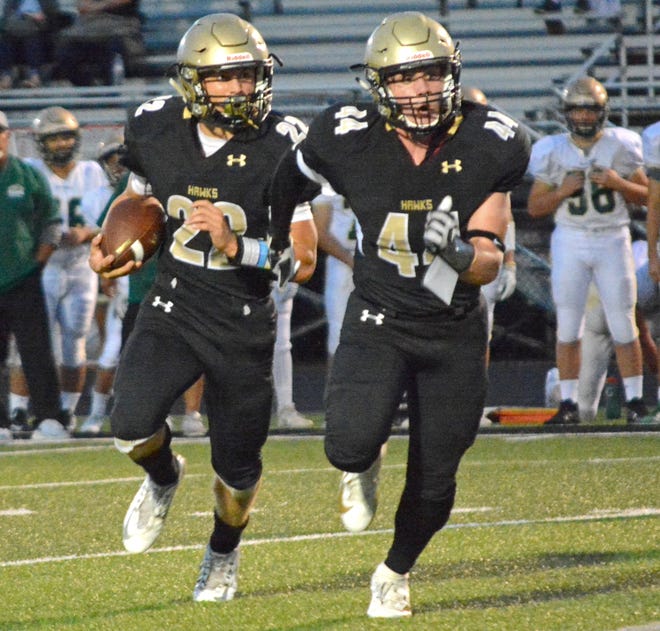 Corning's Max Freeman (22) looks for the edge with fullback Dillon Kennedy (44) leading the way. [TOM PASSMORE/THE LEADER]
