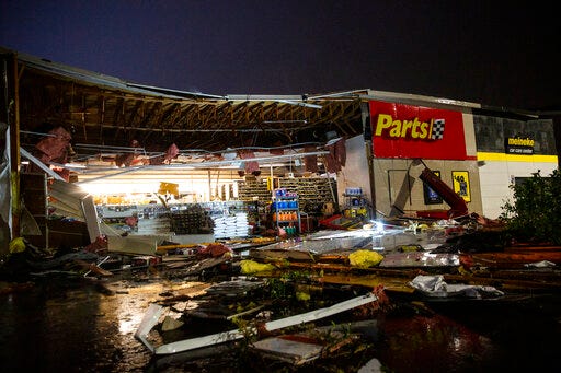 In this Tuesday, Sept. 10, 2019 photo, debris litters the ground at Advance Auto Parts following severe weather in Sioux Falls, S.D. (Abigail Dollins/The Argus Leader via AP)