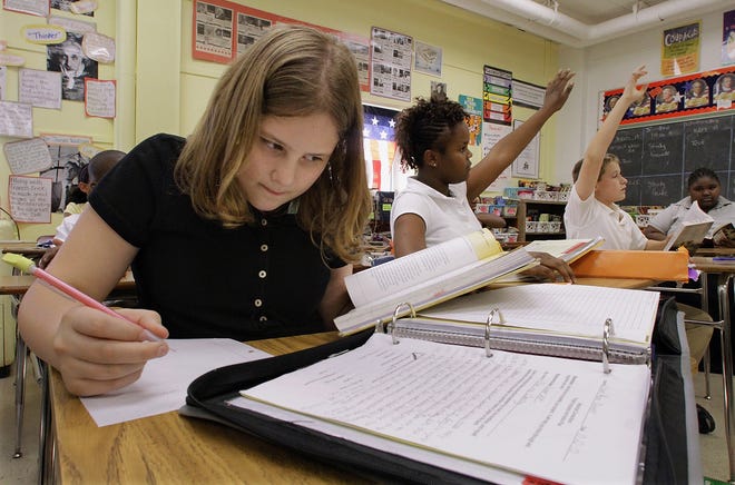 Students participate in their seventh grade history class lesson. [AP FILE PHOTO BY SETH PERLMAN]