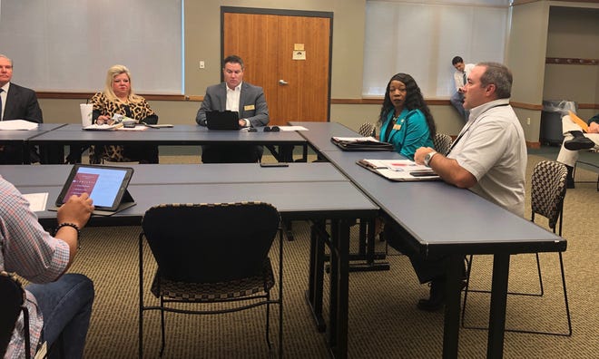 Deputy Administrator Jeff Dingman, right, and Utilities Department Communications and training manager Jurena Storm, center, present to the Board of Directors on Tuesday, Sept. 10, 2019, information about a Local Correct Count Committee to ensure all residents are included in the 2020 U.S. Census. [JADYN WATSON-FISHER/TIMES RECORD]
