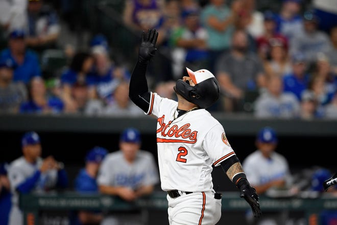 Baltimore Orioles' Jonathan Villar celebrates his three-run home run during the seventh inning of the team's baseball game against the Los Angeles Dodgers on Wednesday in Baltimore. Villar connected for the 6,106th homer in the majors this season. That topped the mark of 6,105 set in 2017. The Orioles won 7-3. [Nick Wass/The Associated Press]