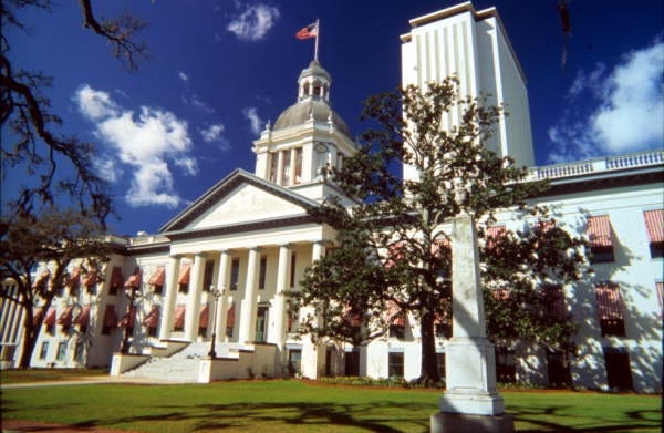 The Florida Historic Capitol with the new Capitol in the background. A legislative panel is forecasting a state budget surplus next year, but budget shortfalls loom in future years. [H-T Archive]