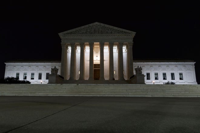 FILE - In this July 16, 2019, file photo, the Supreme Court is seen in Washington. The Supreme Court is allowing nationwide enforcement of a new Trump administration rule that prevents most Central American immigrants from seeking asylum in the United States. The justices’ order late Wednesday, Sept. 11, temporarily undoes a lower court ruling that had blocked the new asylum policy in some states along the southern border. (AP Photo/Carolyn Kaster)